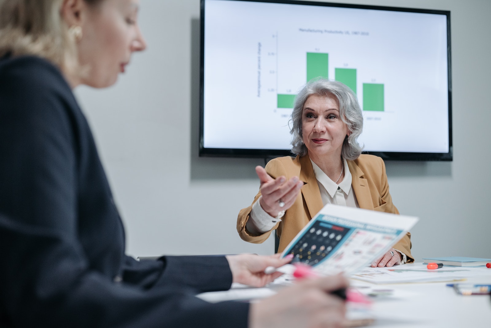 Using for top 10 women empowerment speeches. Images description - Business Women Having a Meeting Inside the Office